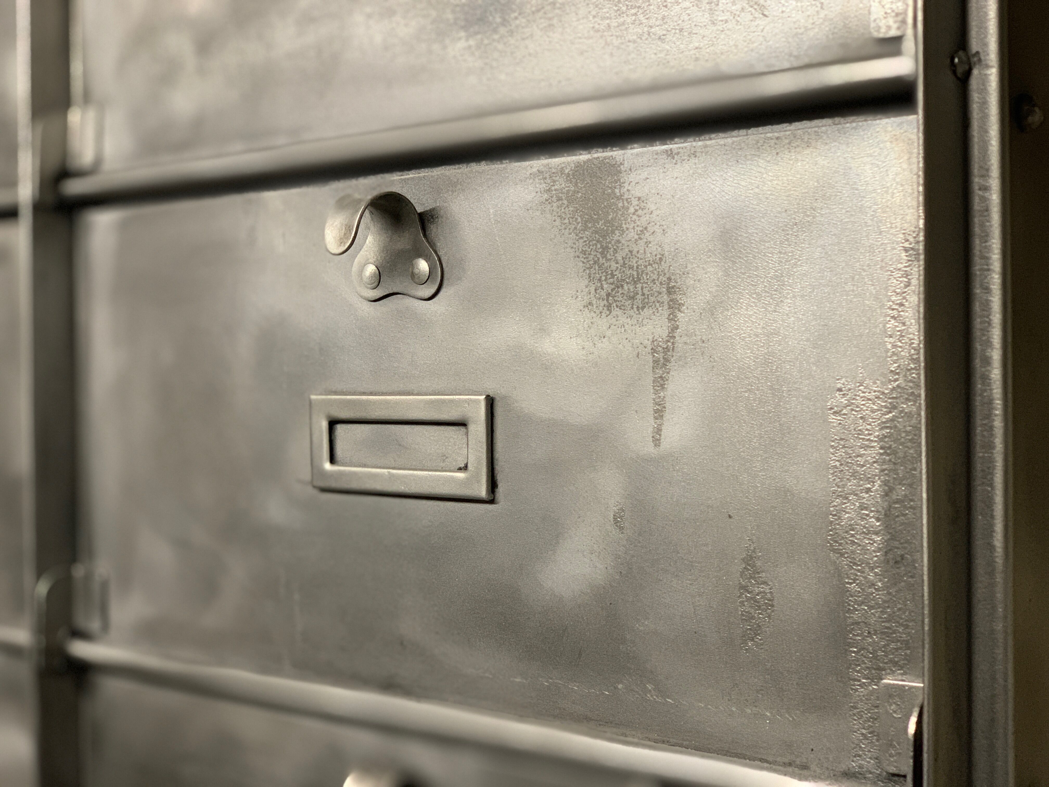 Industrial cladding furniture in brushed and patinated steel