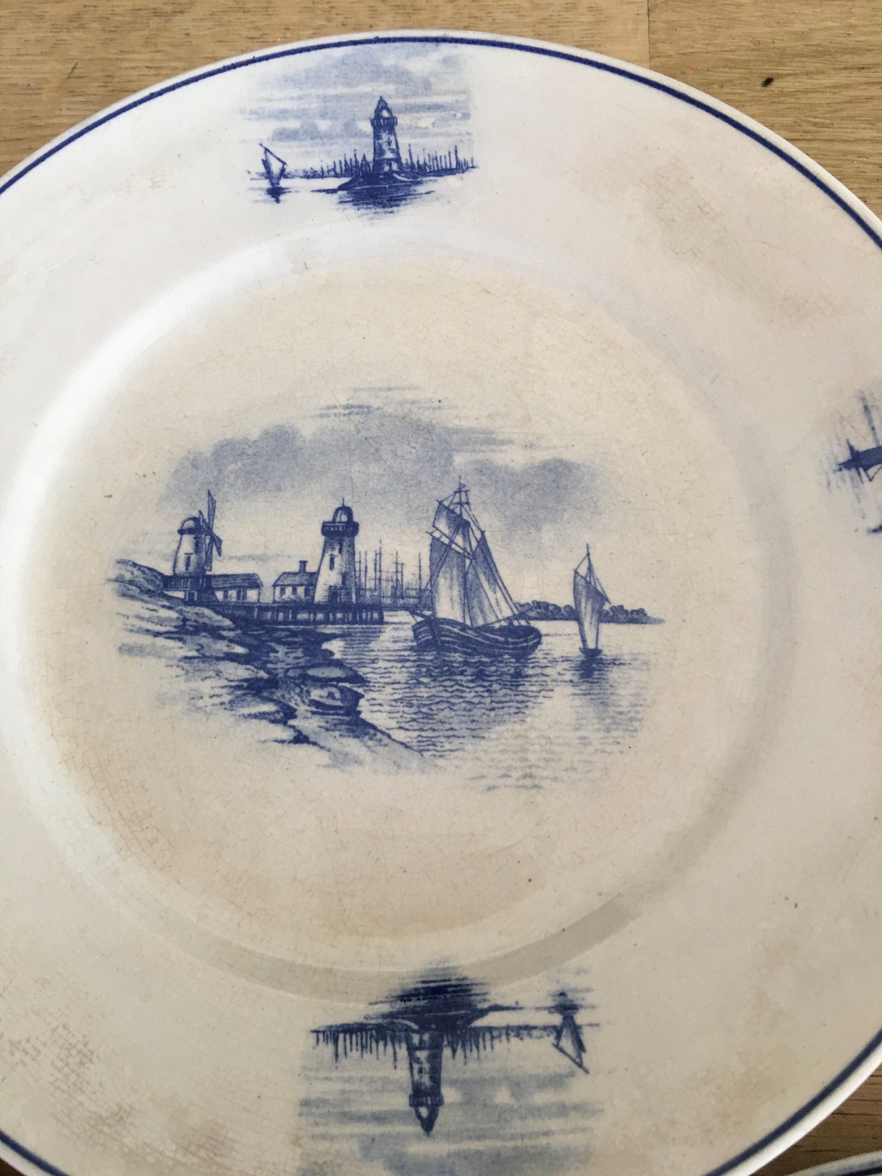 Series of 11 flat plates, Dutch earthenware, early XX