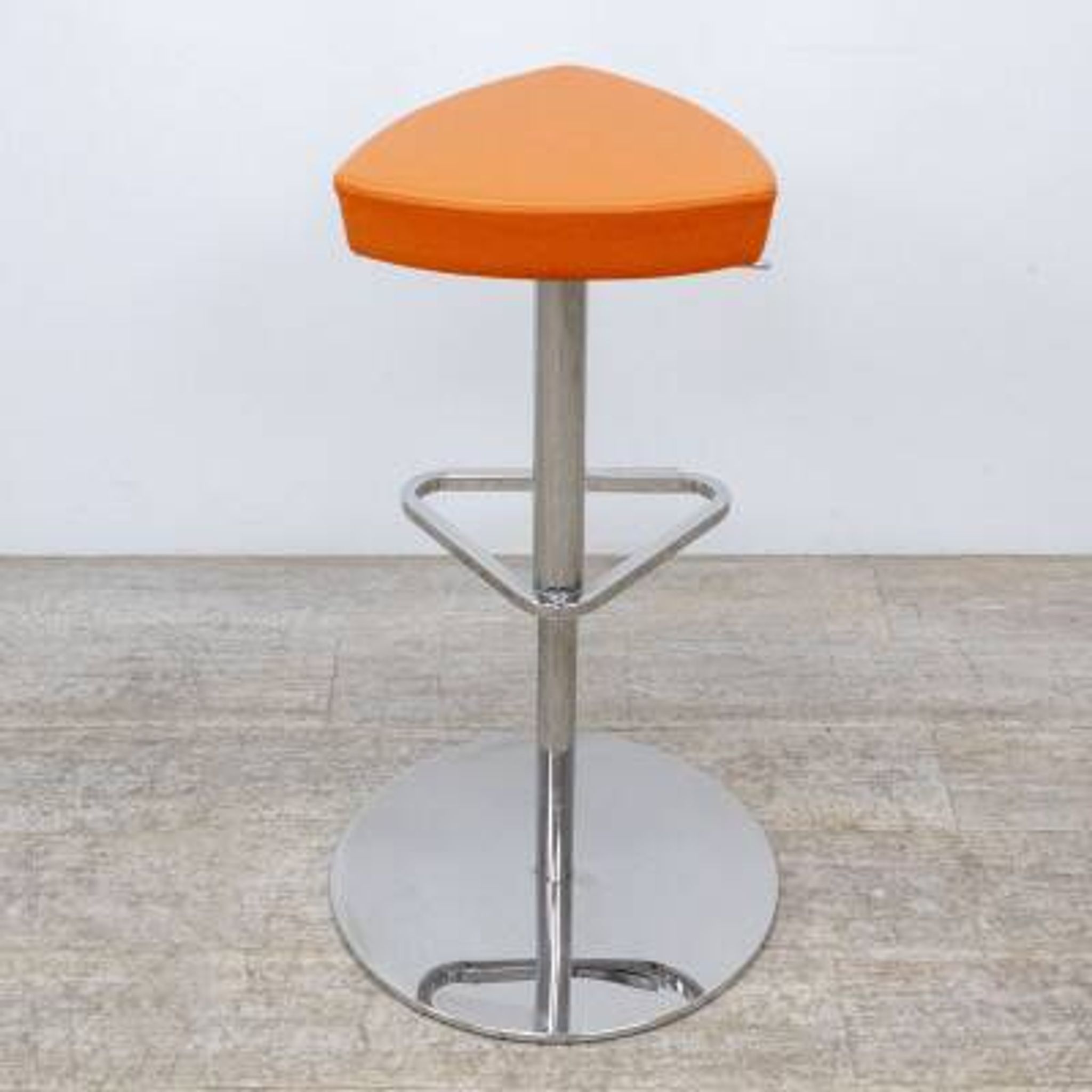 Adjustable orange swivel bar stool