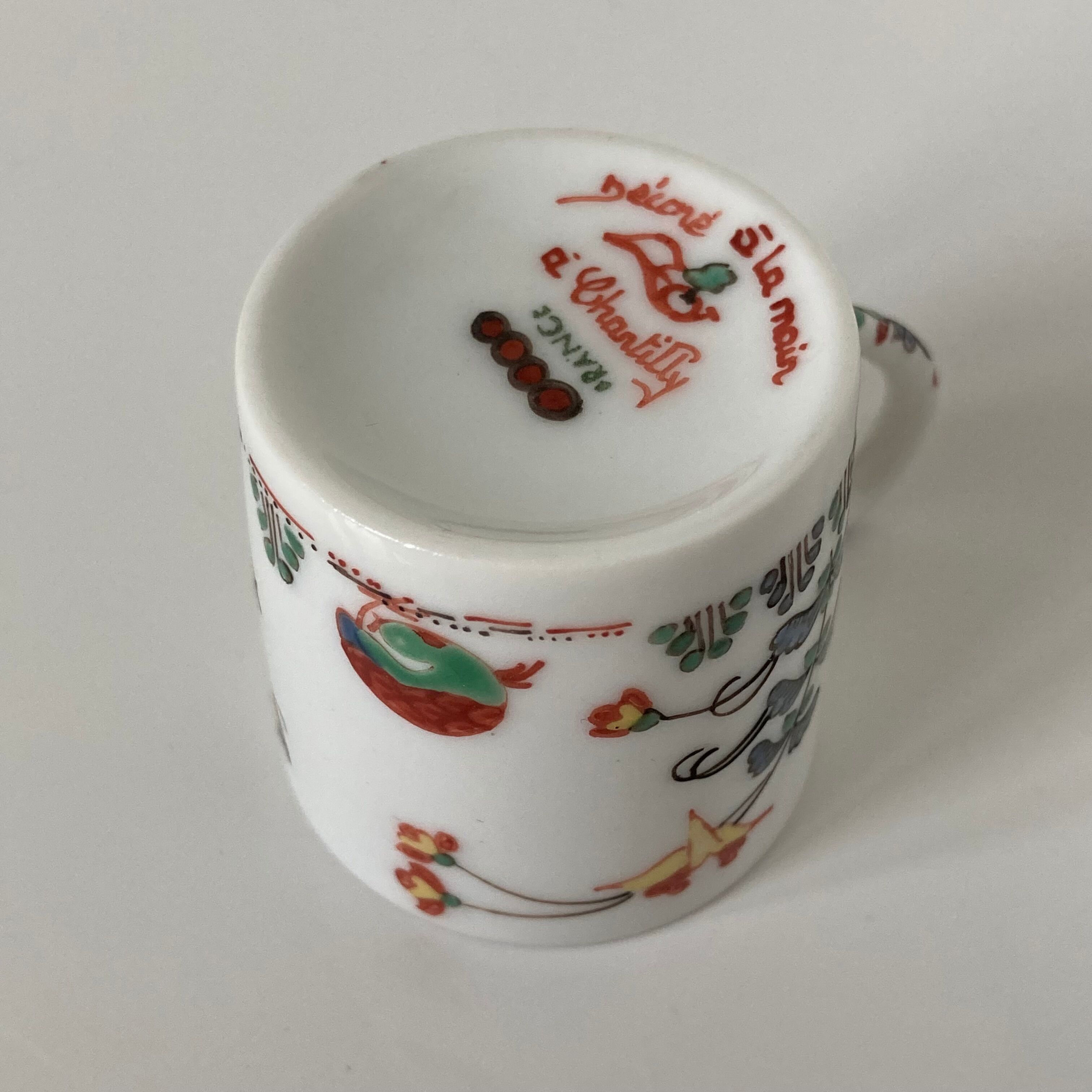 Limoges porcelain cup and sub-cup decorated in Chantilly in the Japanese Kakiemon style