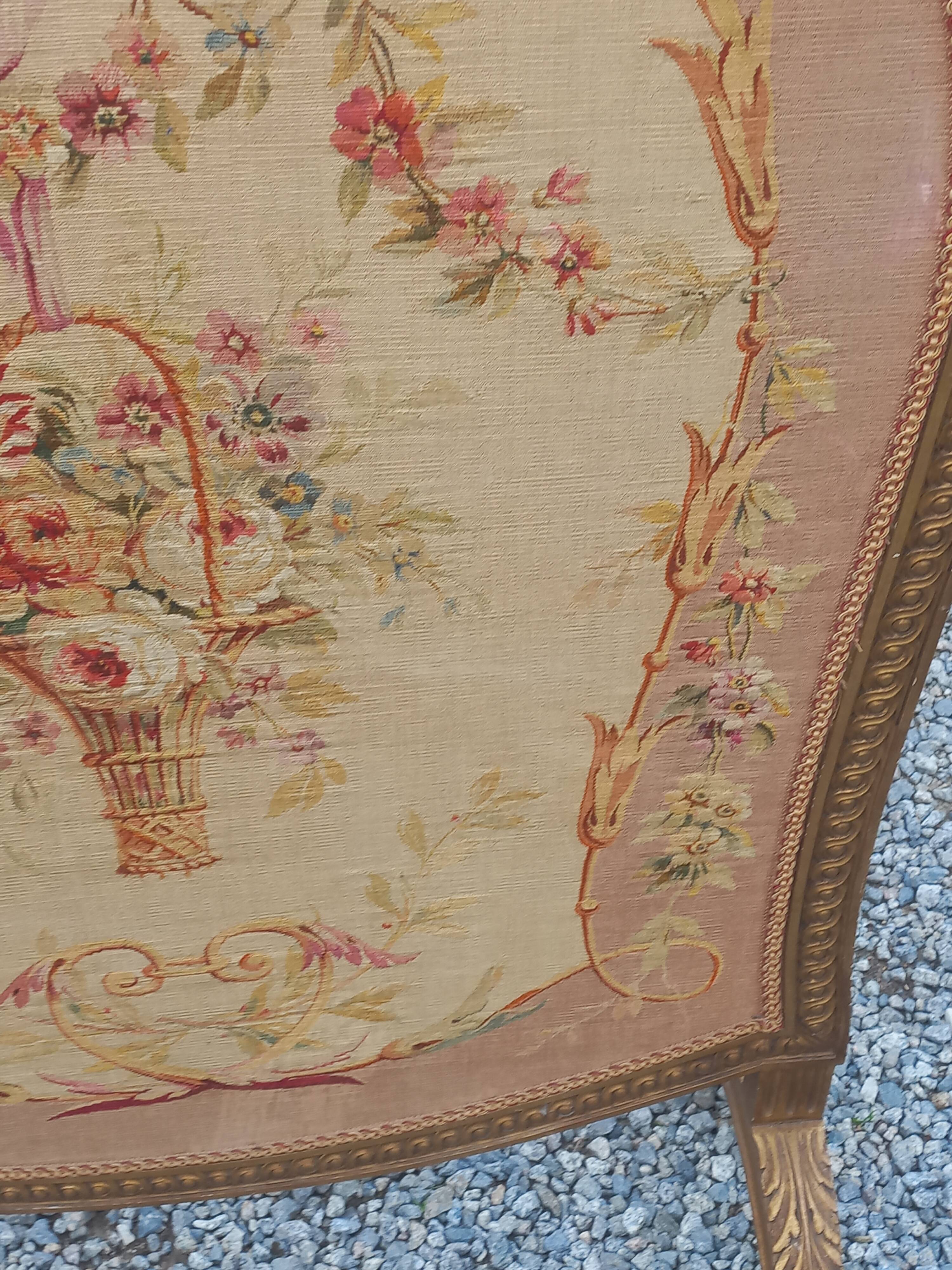 Golden wooden fireplace screen and Aubusson tapestry, 19th century.