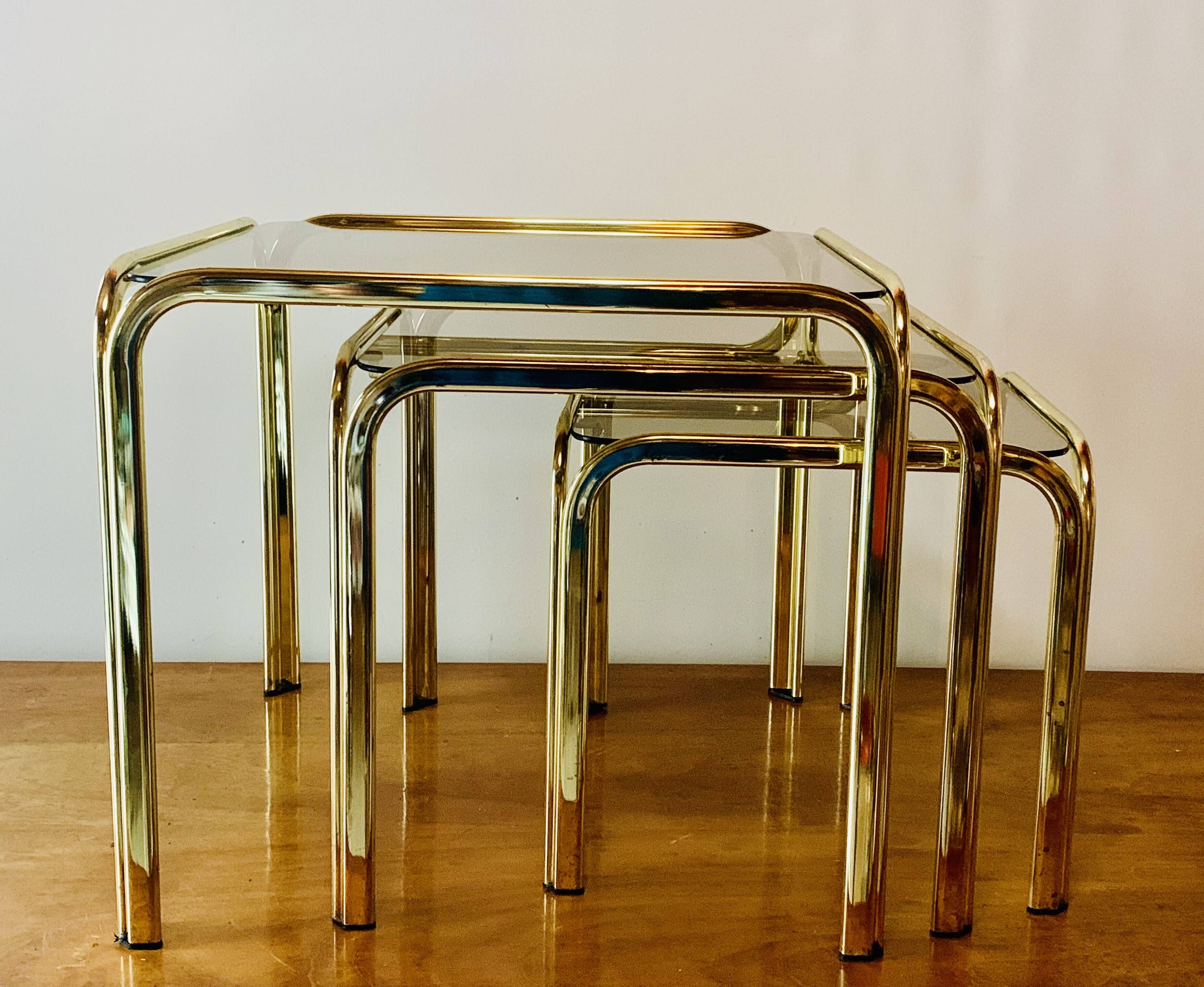 Vintage nesting tables in gold metal and smoked glass