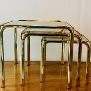 Vintage nesting tables in gold metal and smoked glass