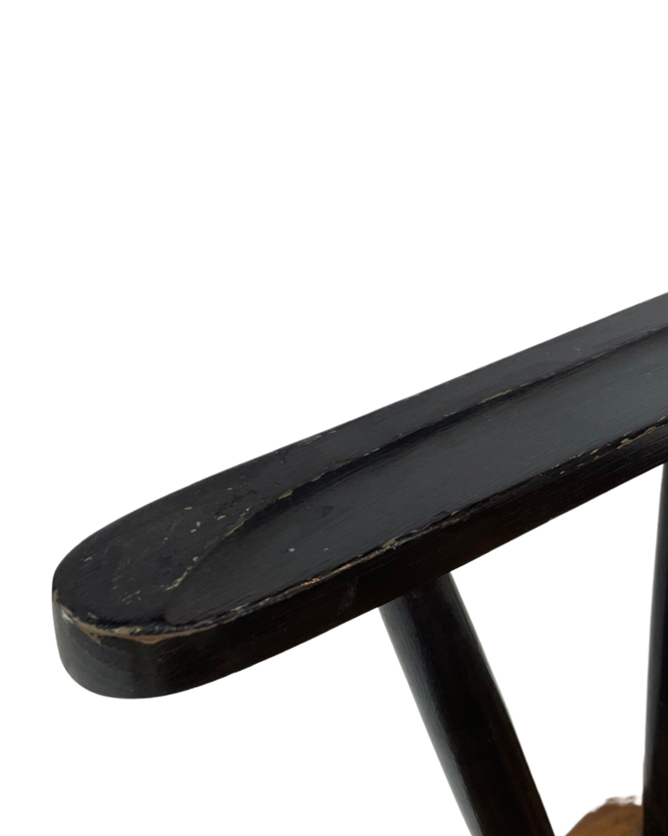 Vintage easy chair with high back and armrest from the 60s