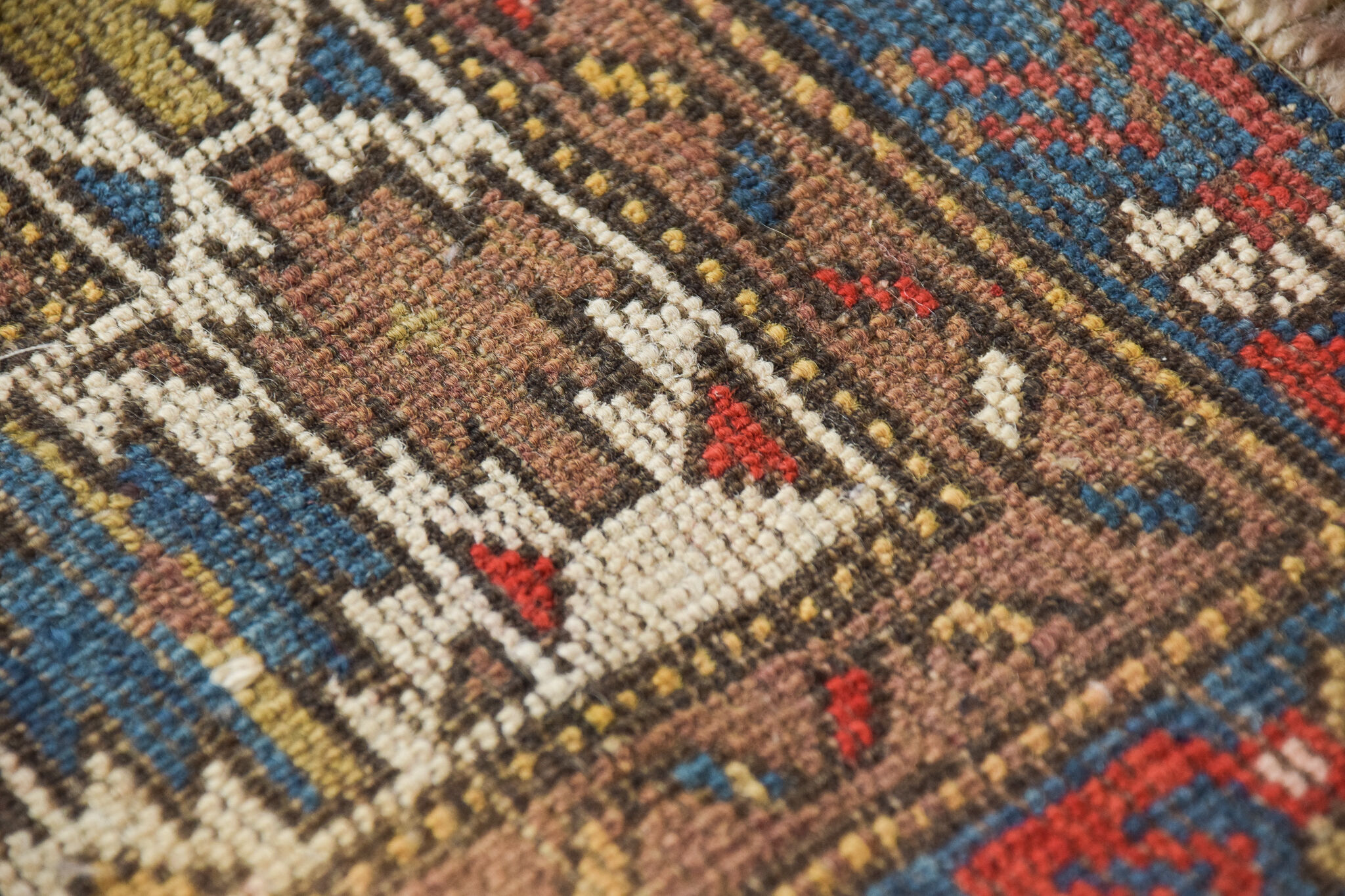 Handwoven blue ground persian rug with bird-like figures