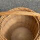 Round woven rattan and wicker umbrella holder with handle
