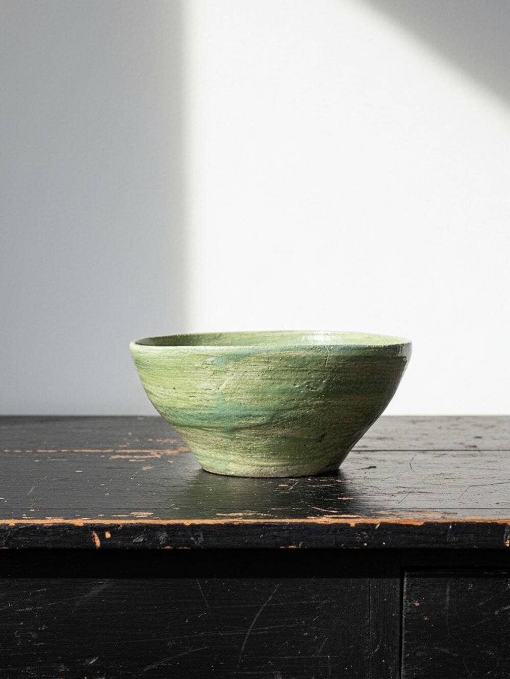 Wabi-Sabi handcrafted ceramic bowl in celadon green, 20th-19th century.
