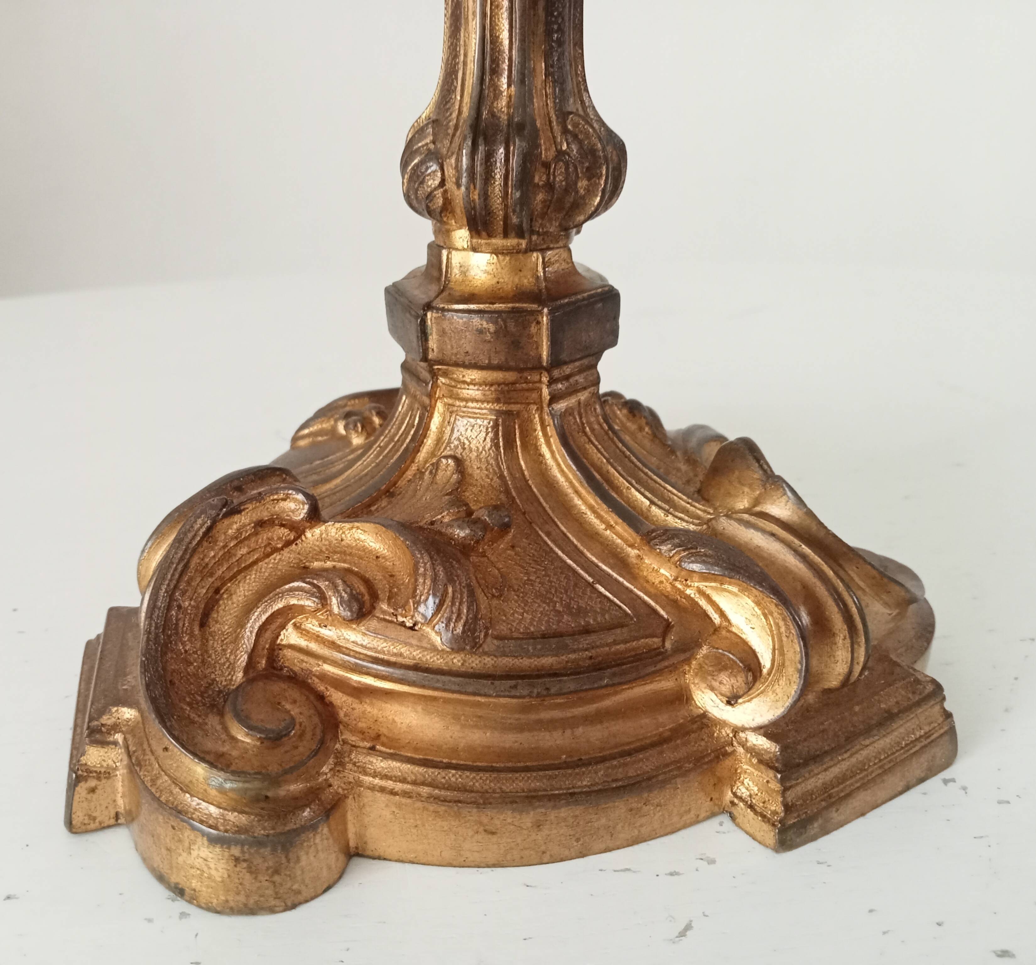 Antique 19th-century solid gilded bronze candlestick in the Louis XV style.
