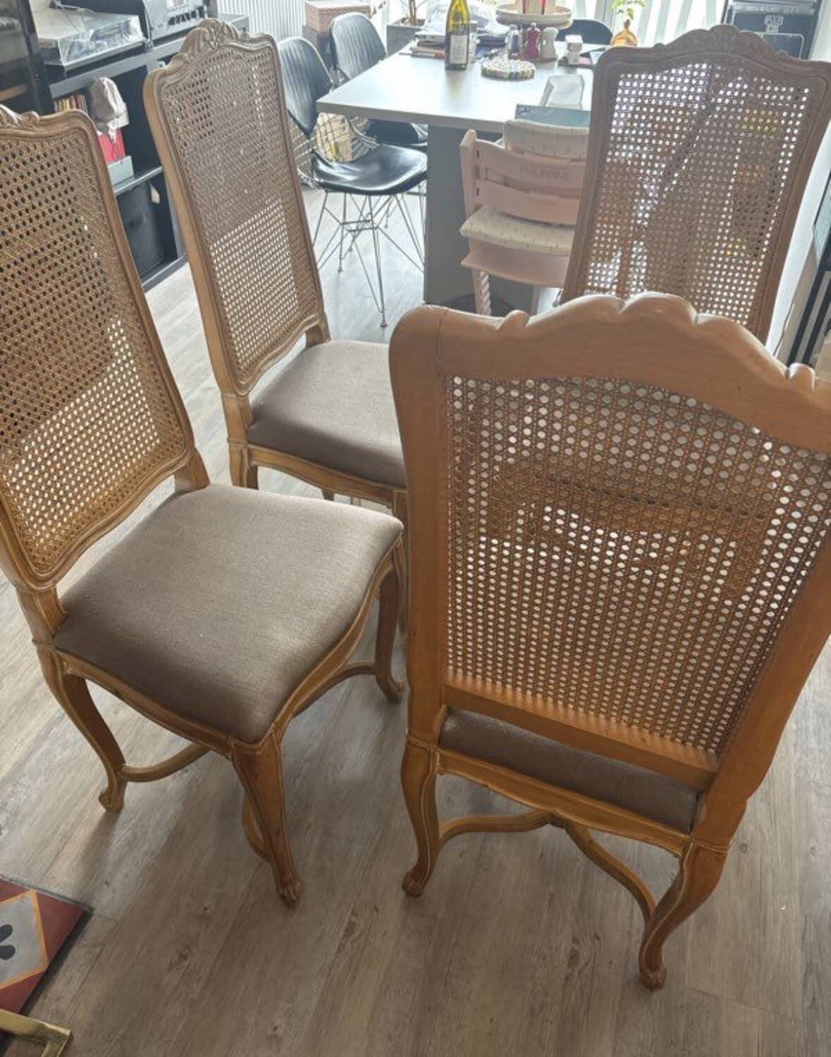 Four antique chairs in classic style with caning and upholstery.