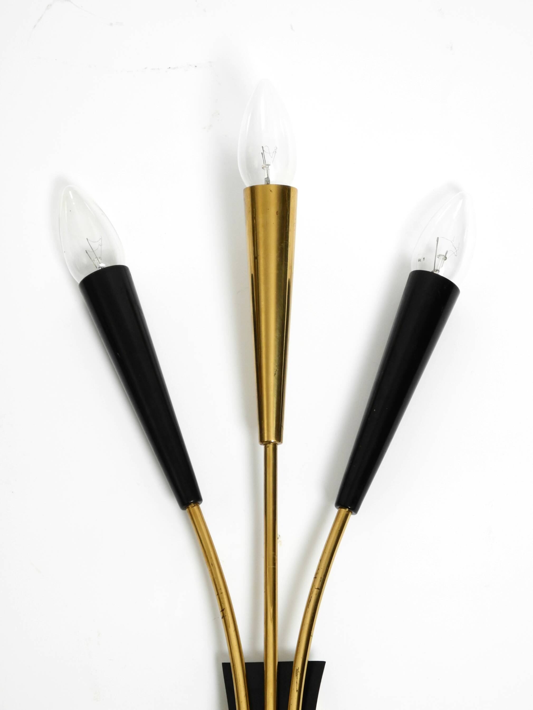 Two beautiful large Mid Century Modern brass 3-light cone wall lamps