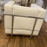 Pair of white leather and chrome armchairs