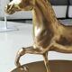 Large vintage horse in exercise figurine on oval base, in polished brass 26 x 19 cm