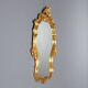 Carved and gilded wooden mirror in Barocchetto style