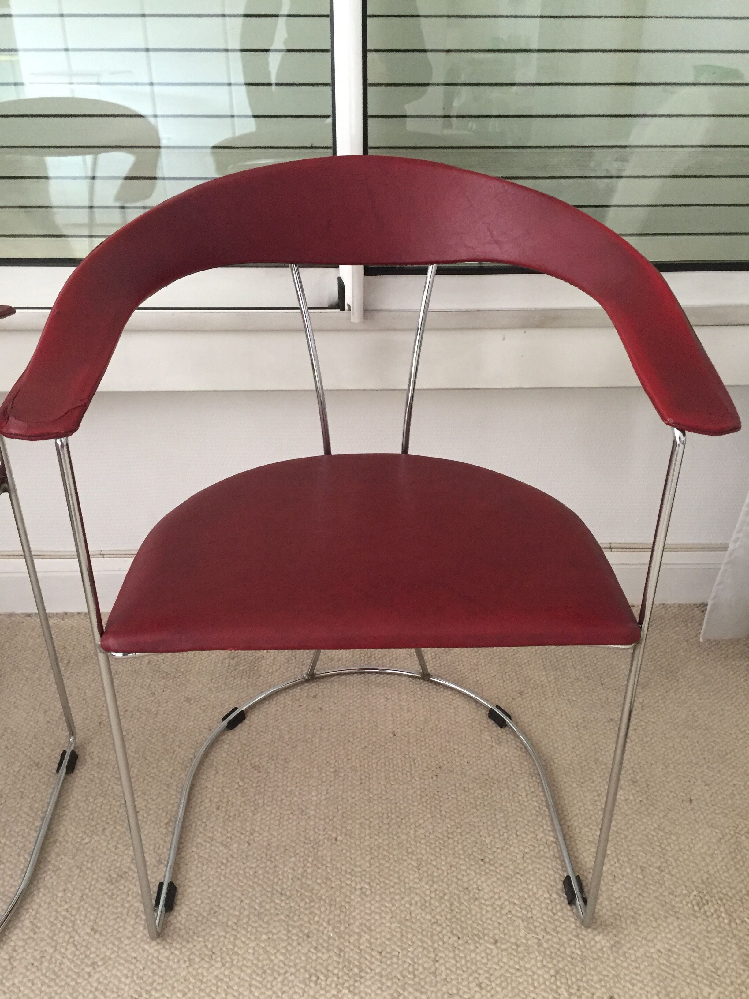 Pair of red chairs in 80s skai