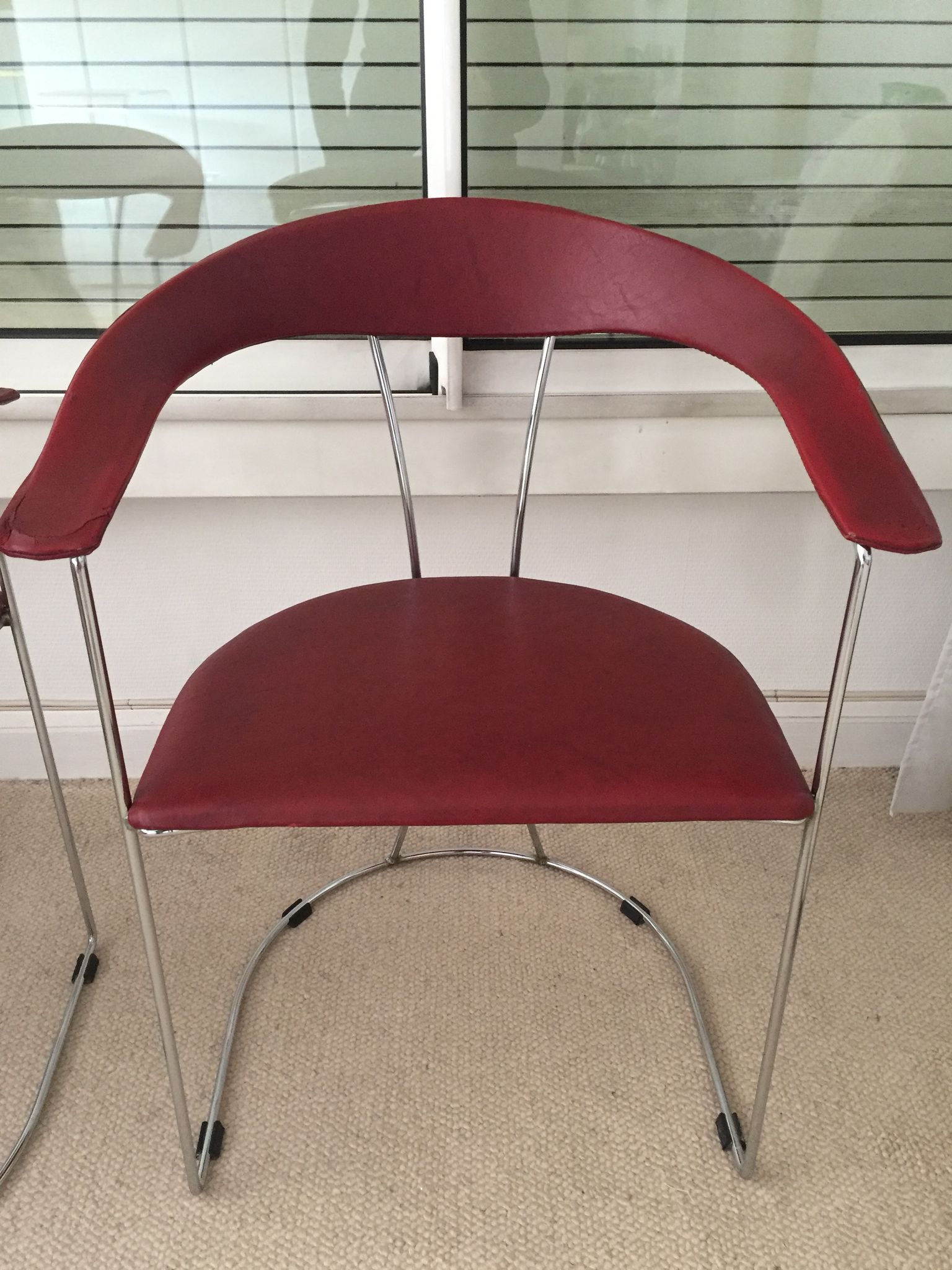 Pair of red chairs in 80s skai