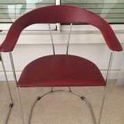 Pair of red chairs in 80s skai