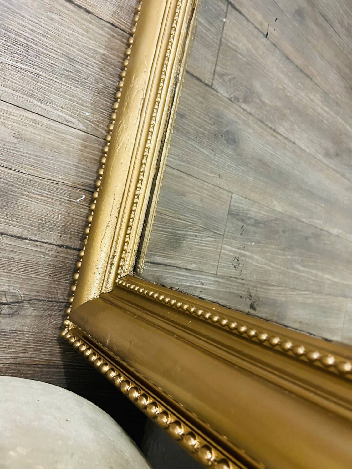 Antique gilded mirror in old Louis Philippe wood