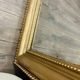 Antique gilded mirror in old Louis Philippe wood