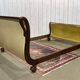 Mahogany lit empire from the early 19th century with swan necks and claw feet.