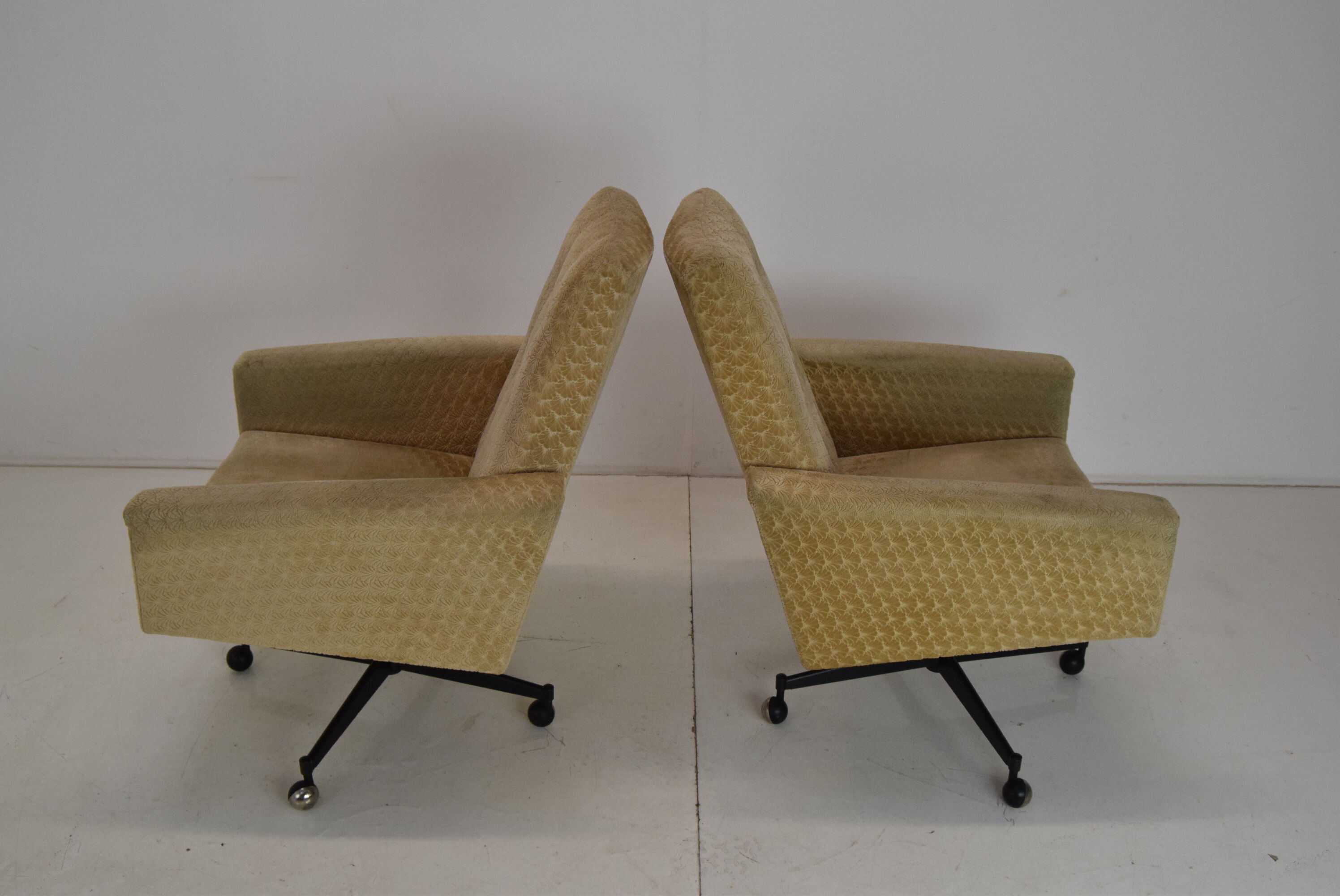 Pair of mid-century swivel armchairs with wheels 1970's