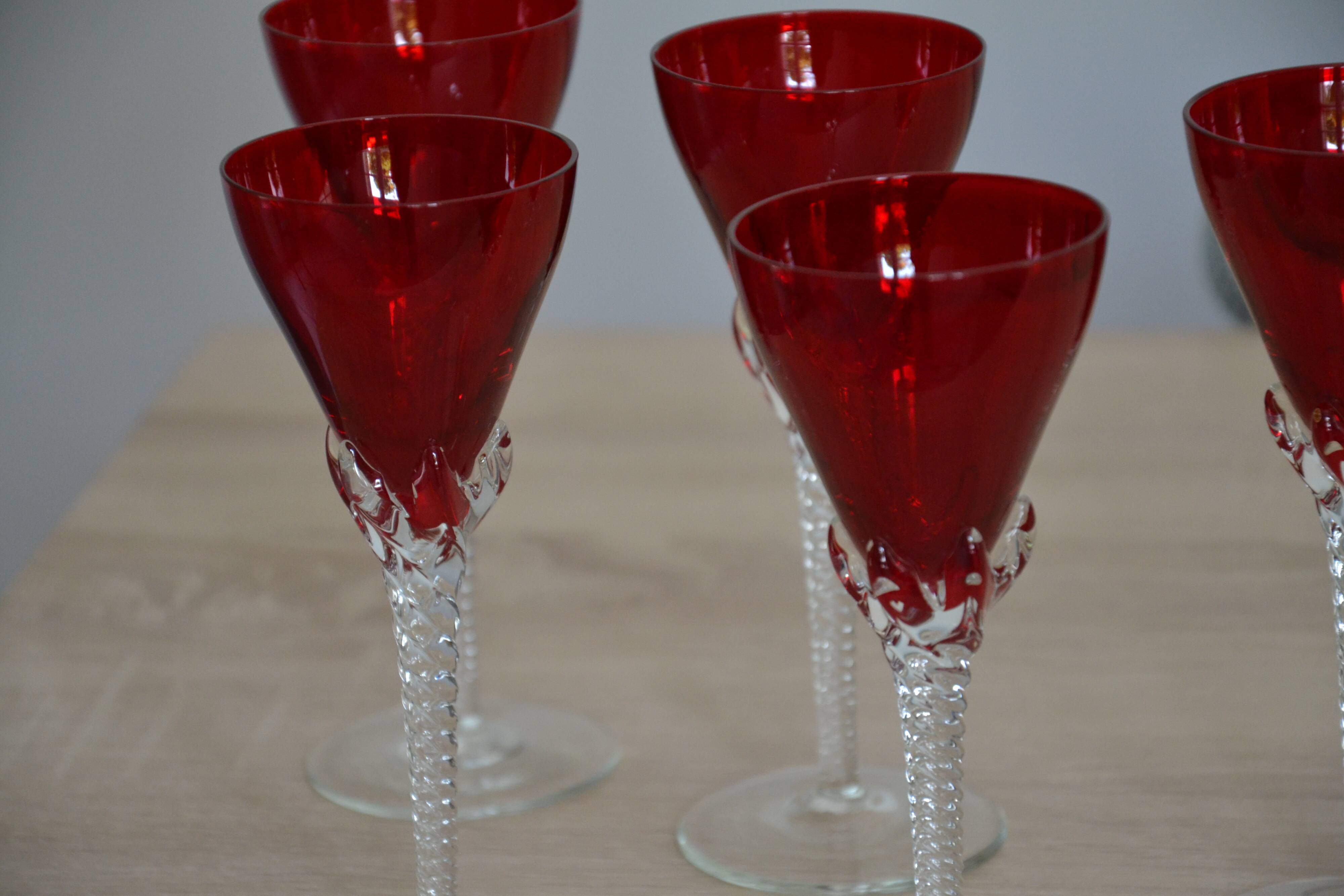 5 red crystal glasses with twisted stems