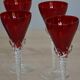 5 red crystal glasses with twisted stems