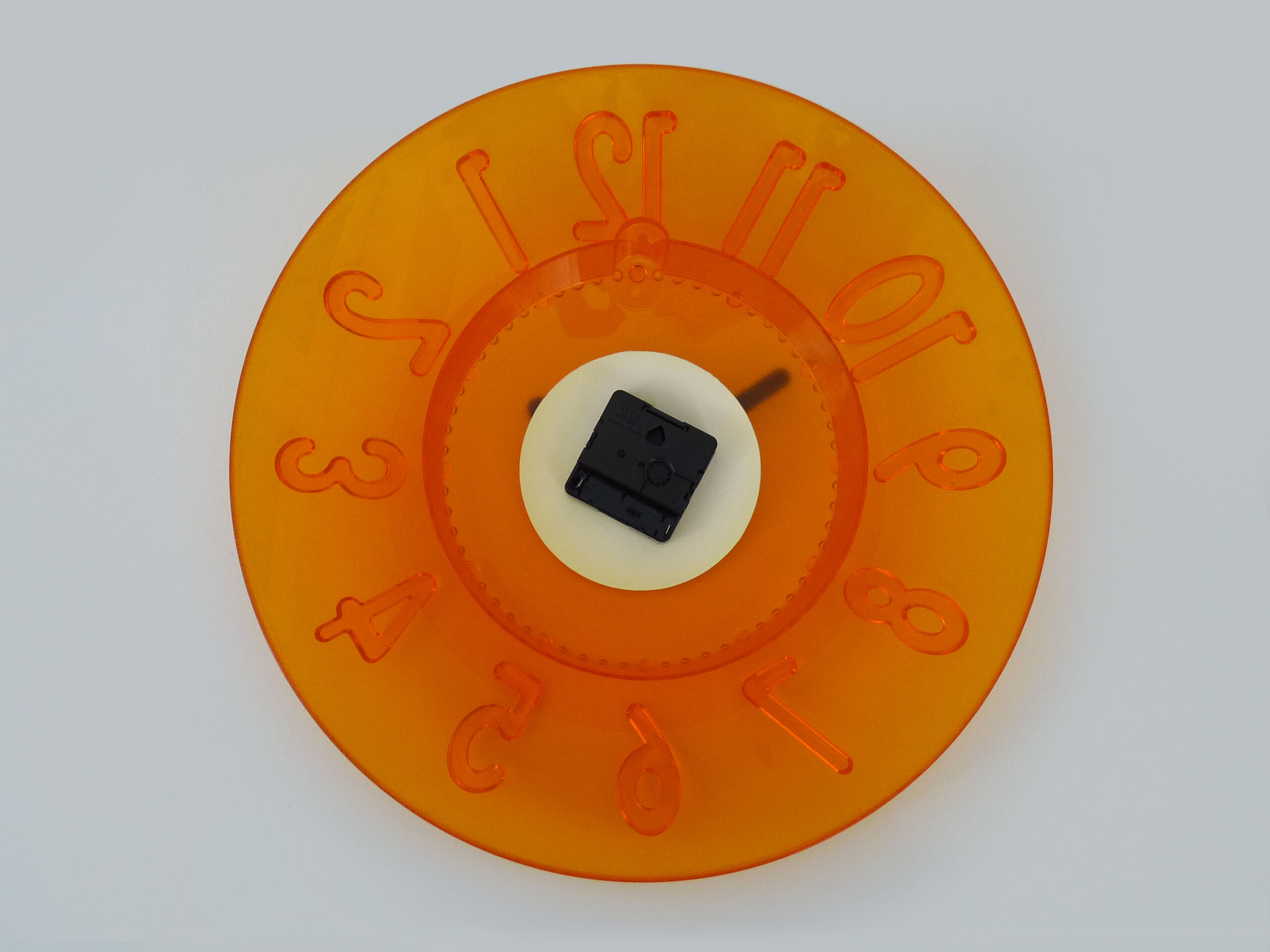 Guzzini orange wall clock from the 1980s