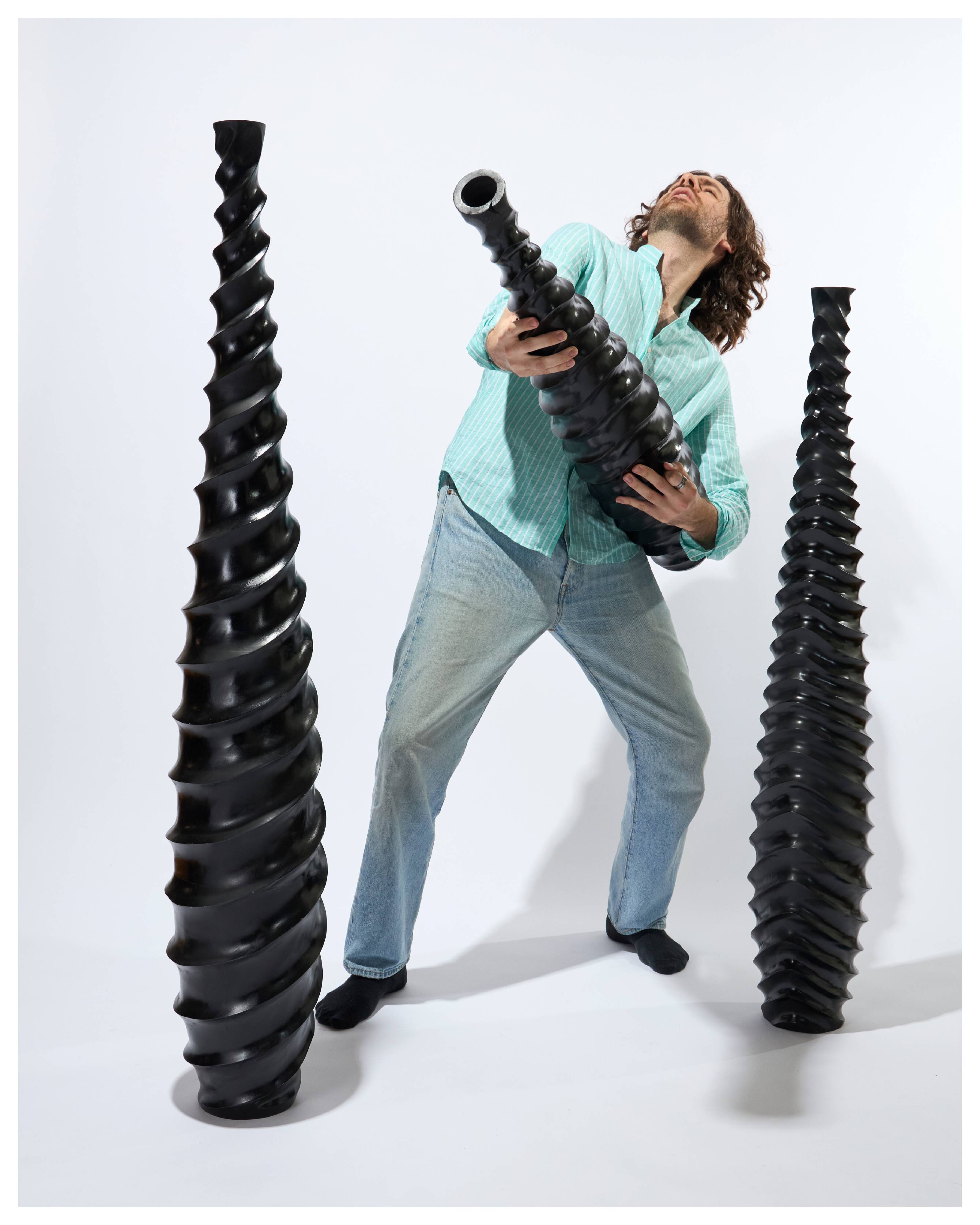 Set of 3 large black vases made of wood and black lacquered.