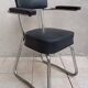 Vintage office chair in chrome metal and faux leather.