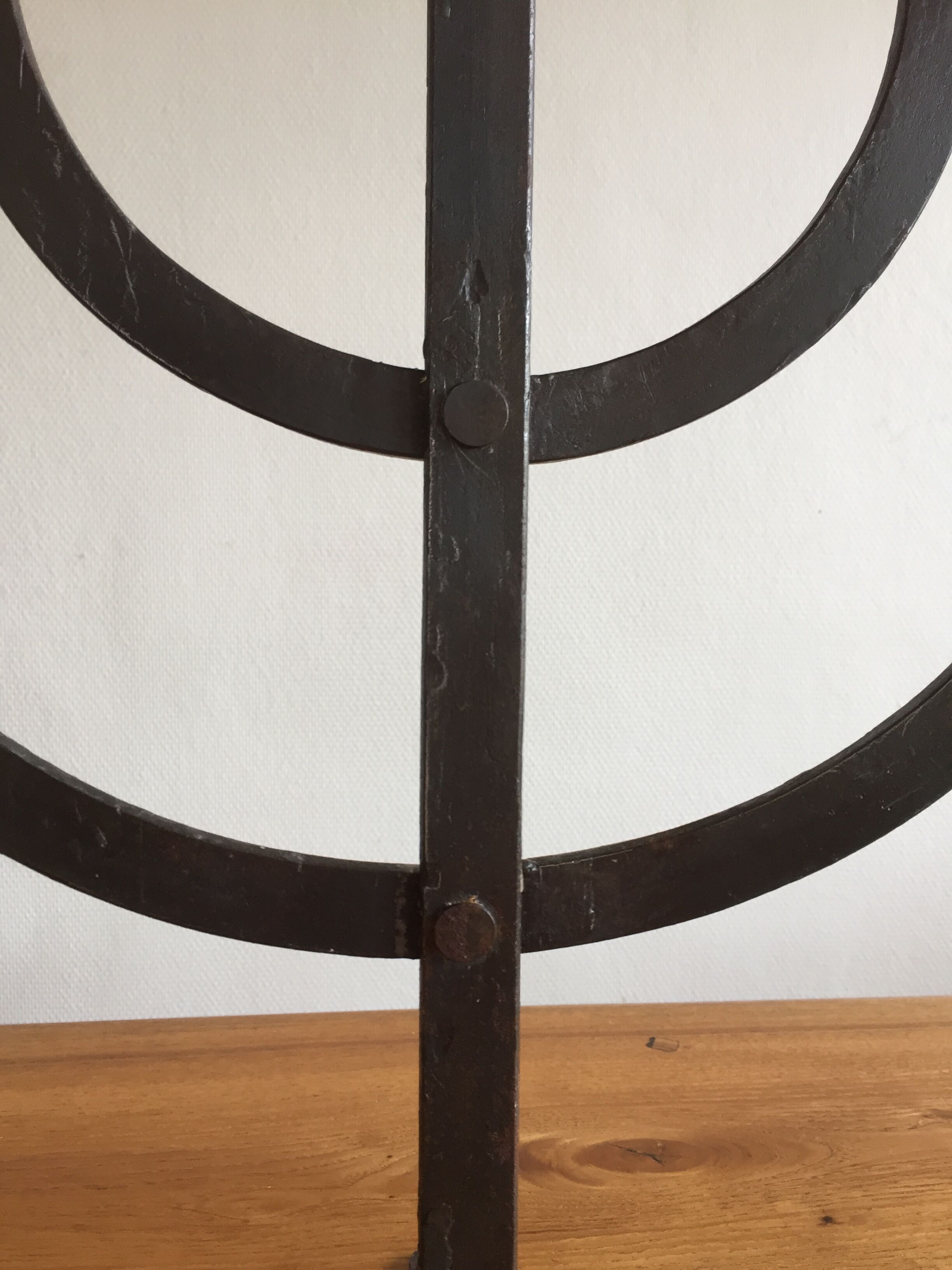 Old iron candelabra shaped high time