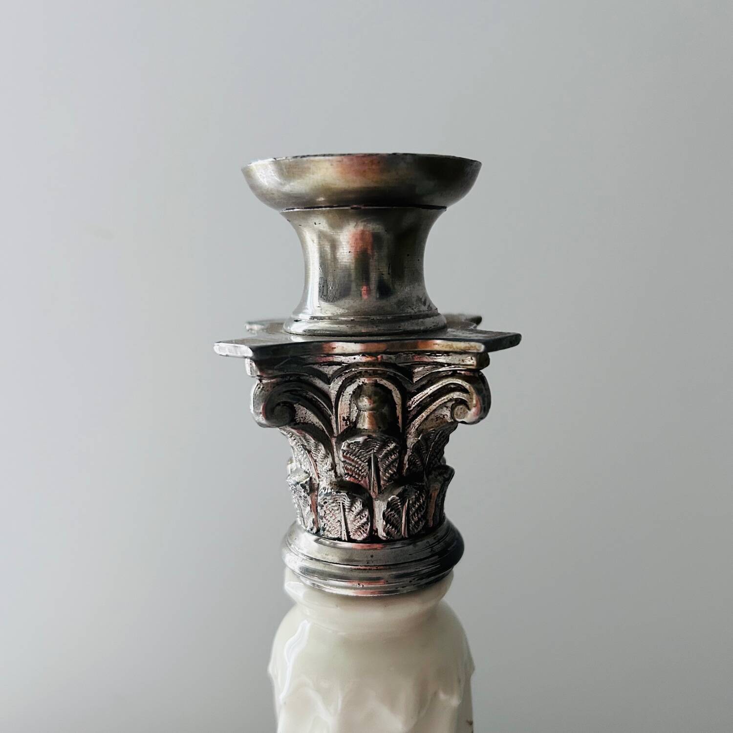 Silver-plated metal and porcelain candlestick