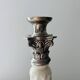 Silver-plated metal and porcelain candlestick