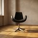 Alipes black swivel salon chair with chrome star base by Giorgetto Giugiaro