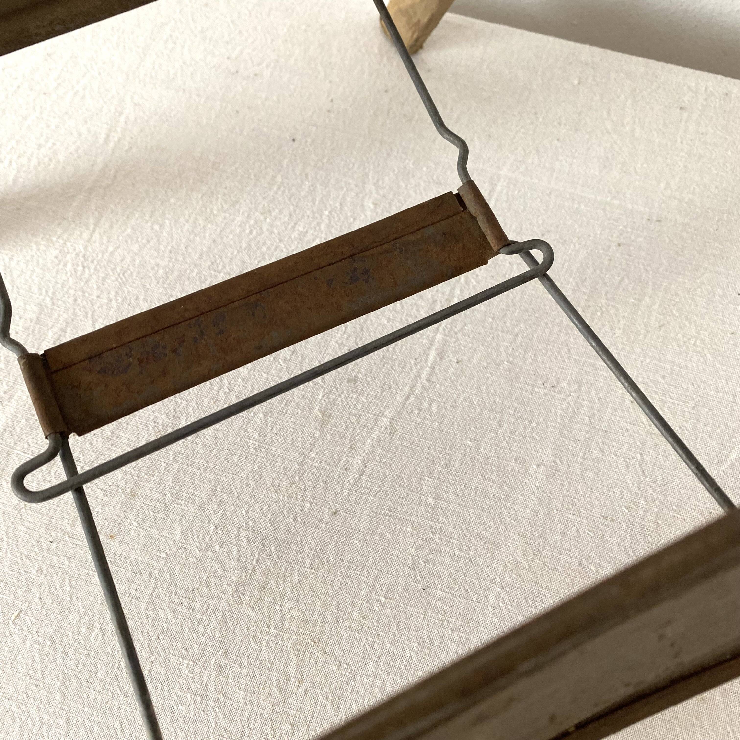 Antique folding stool with slats, plant holder