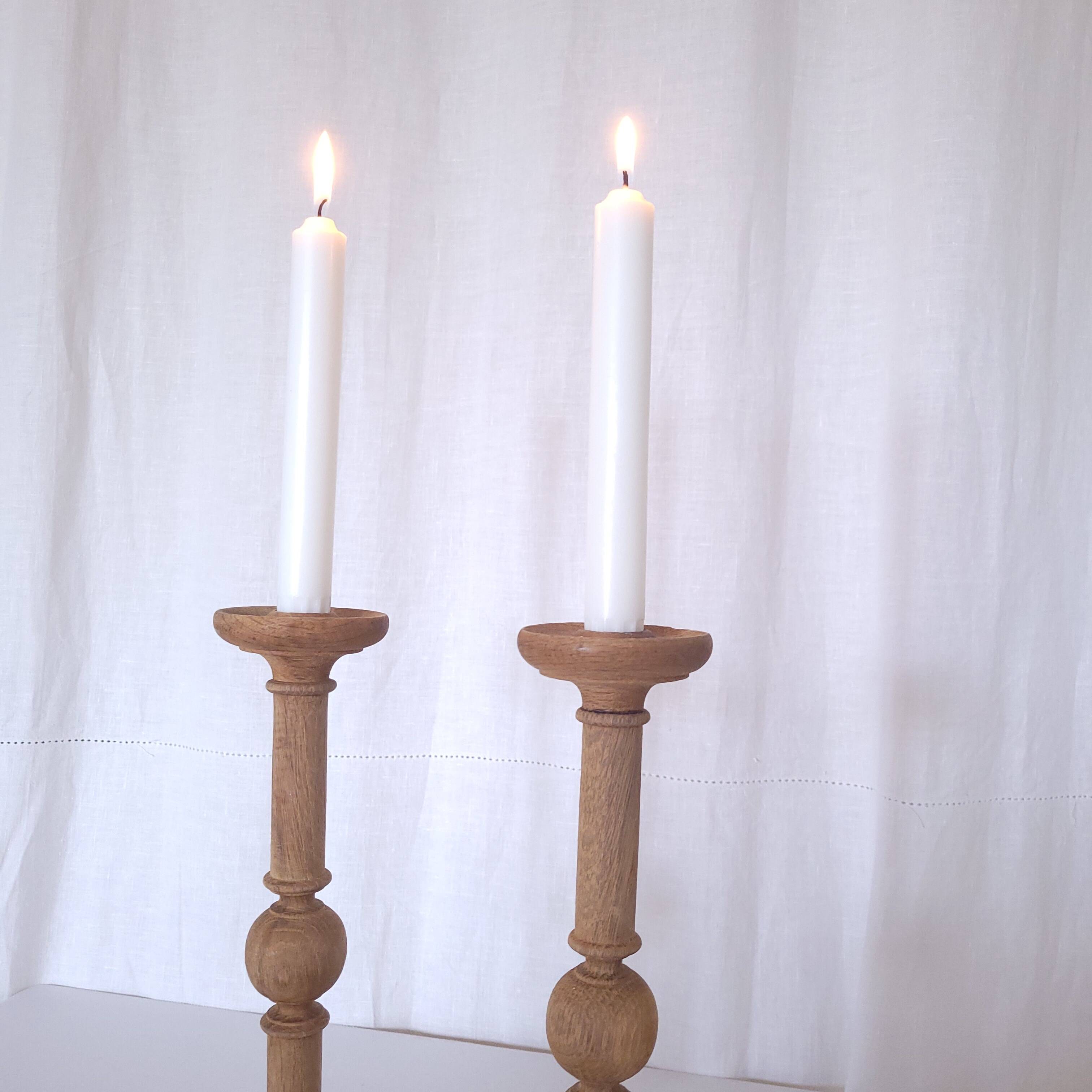 Large carved wooden candlesticks