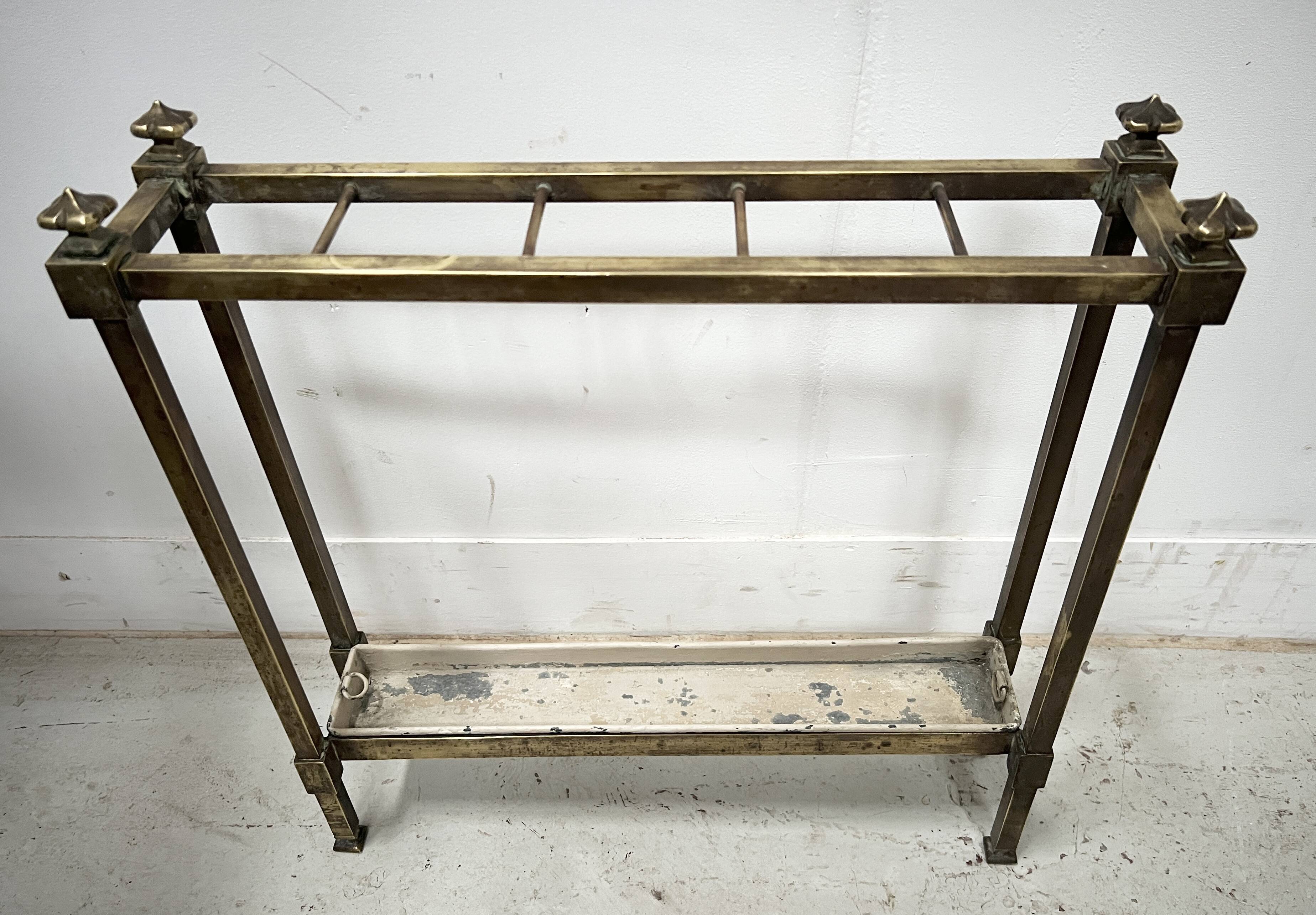 Brass and sheet metal umbrella stands from the 20th century.