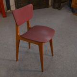 Set of 4 designer chairs in oak and red leatherette from the 1960s