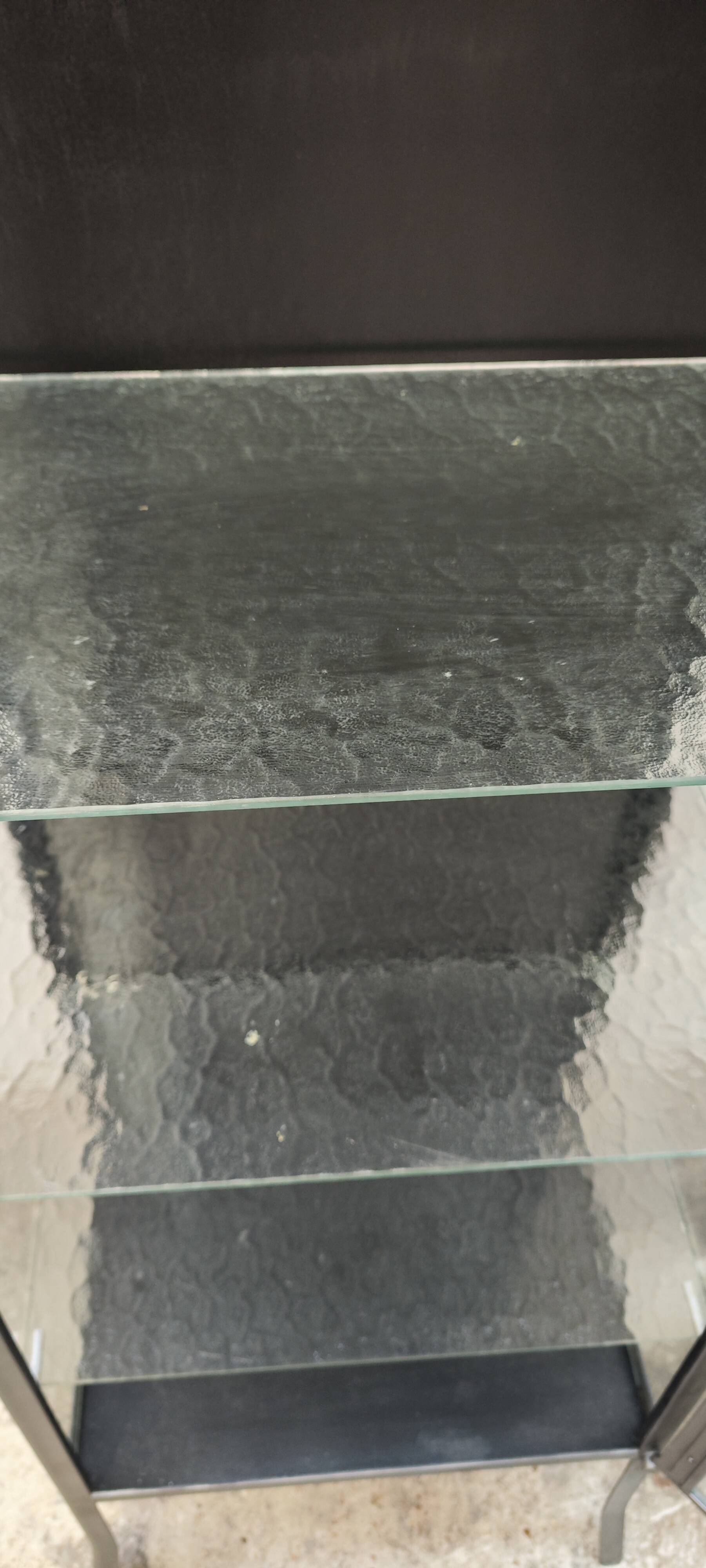 old medical display case with a graphite metal door