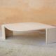 Table basse vintage en travertin par les éditions Roche Bobois