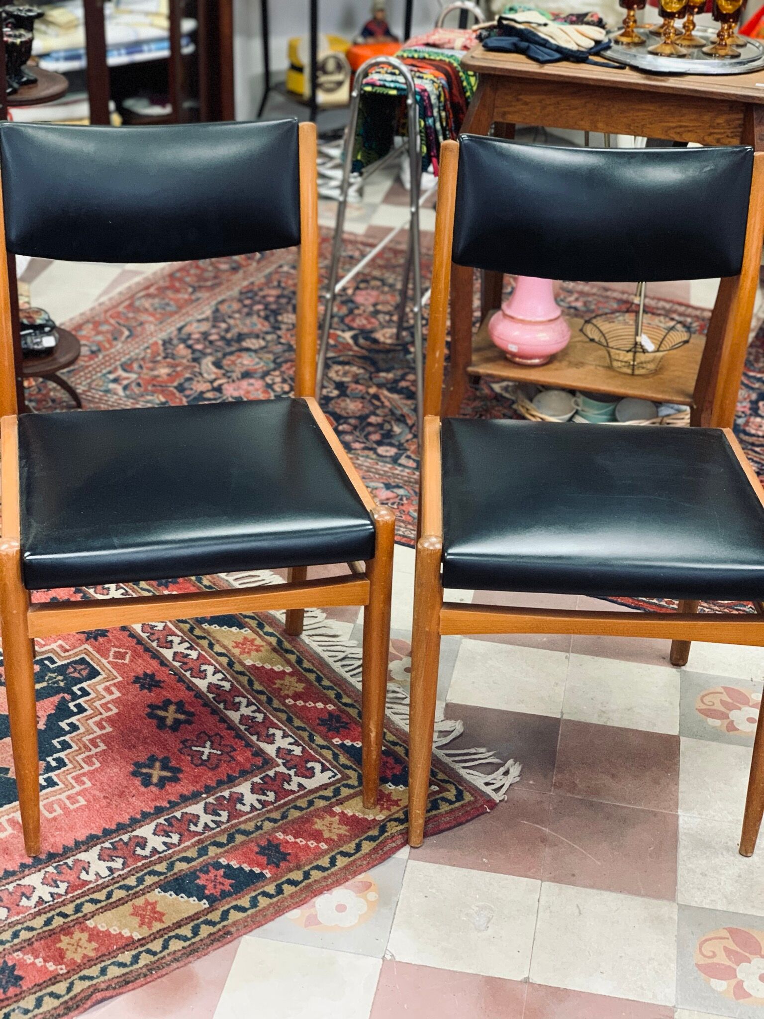 2 Scandinavian-style natural wood chairs, black trim