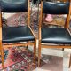 2 Scandinavian-style natural wood chairs, black trim