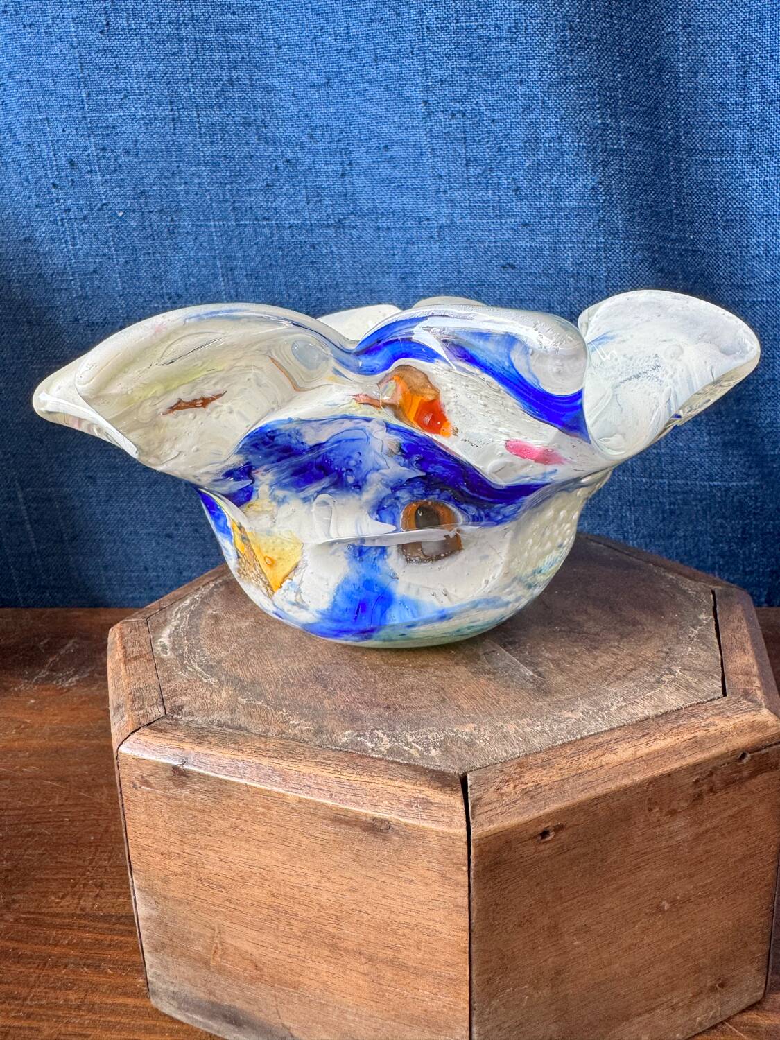 Multi-layer glass ashtray with metallic oxide inclusions.