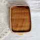 Vintage ceramic trinket dish in mustard color with a braided effect