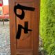 Antique wooden bedside table with marble