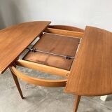 Scandinavian round teak table with extension