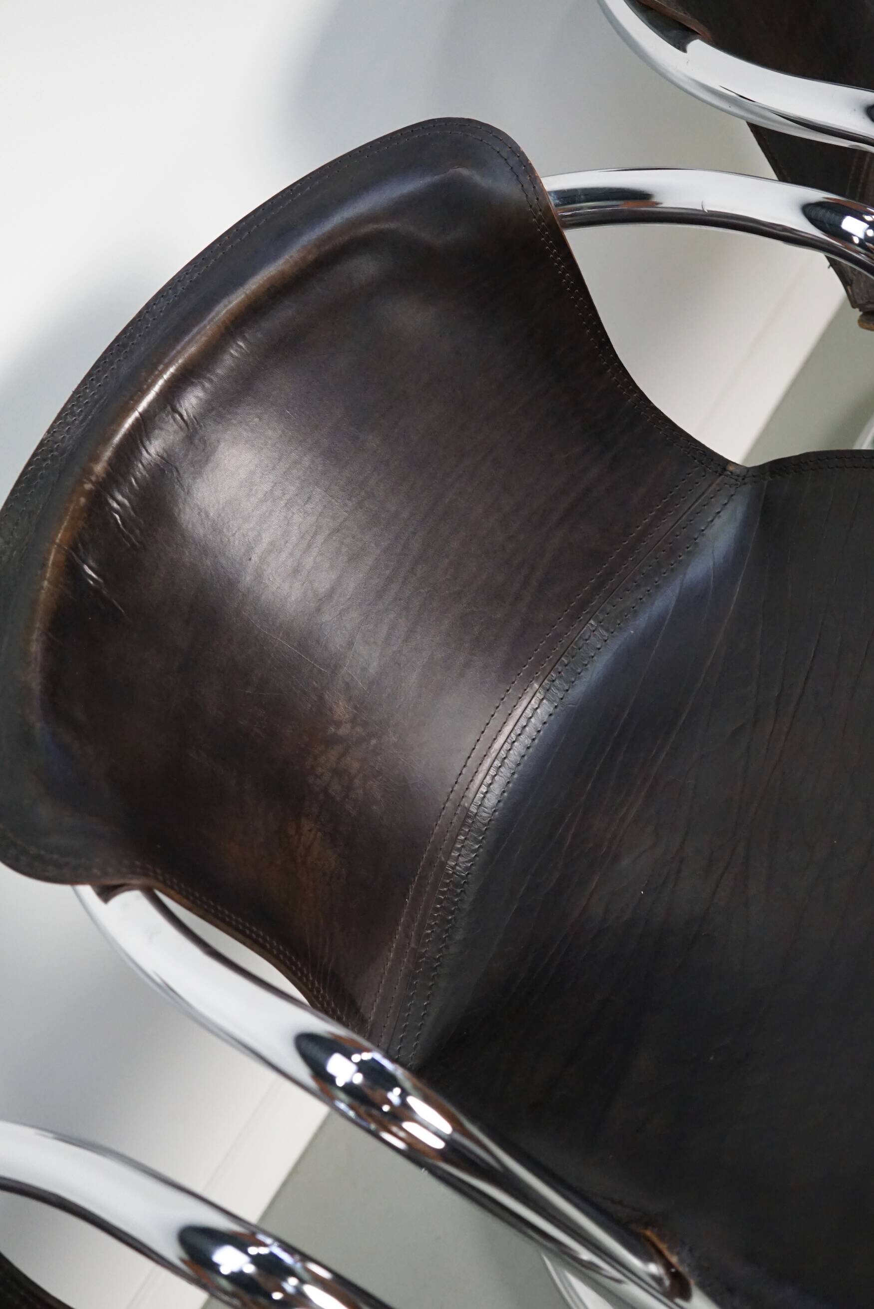 Set of four brown leather dining chairs, Willy Rizzo, 1970