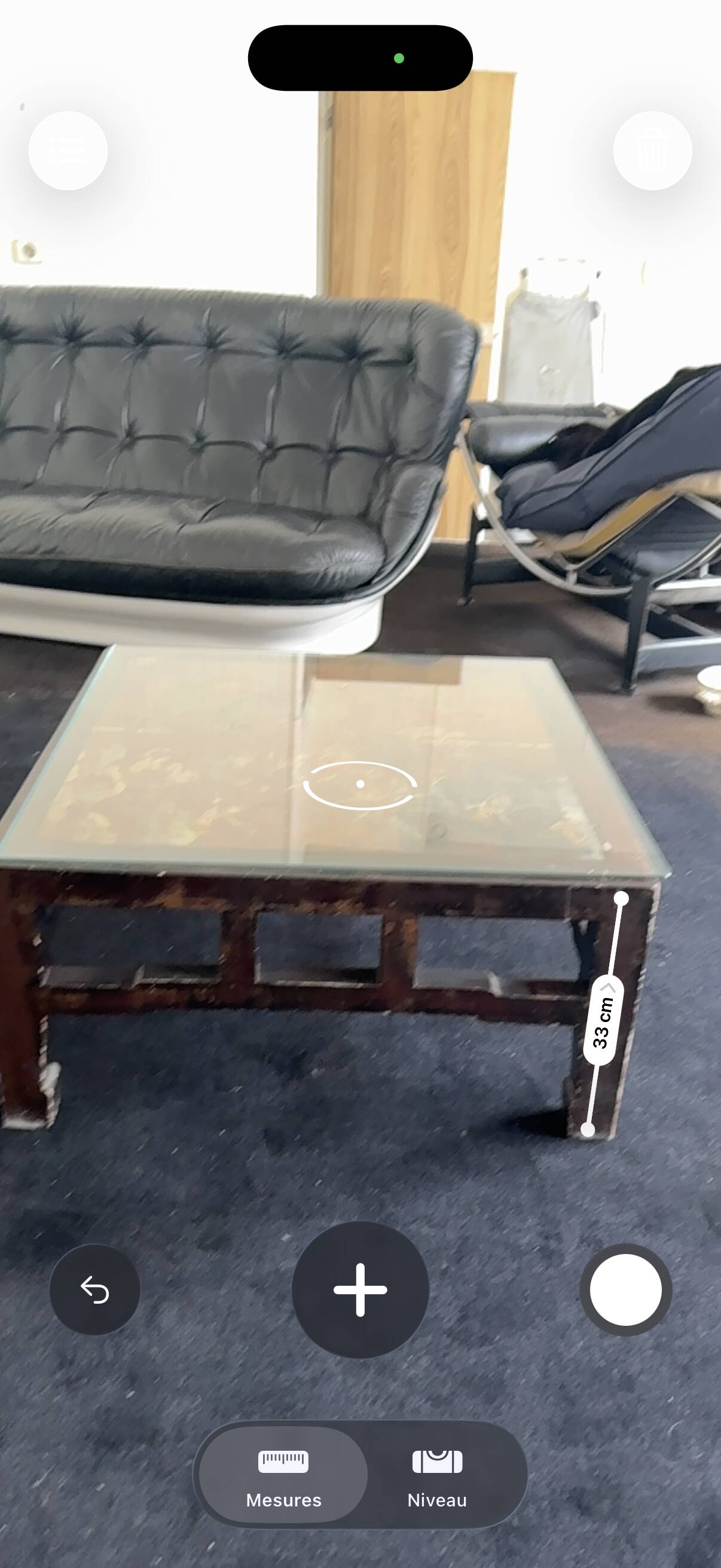 Vintage brutalist coffee table with Asian decor.