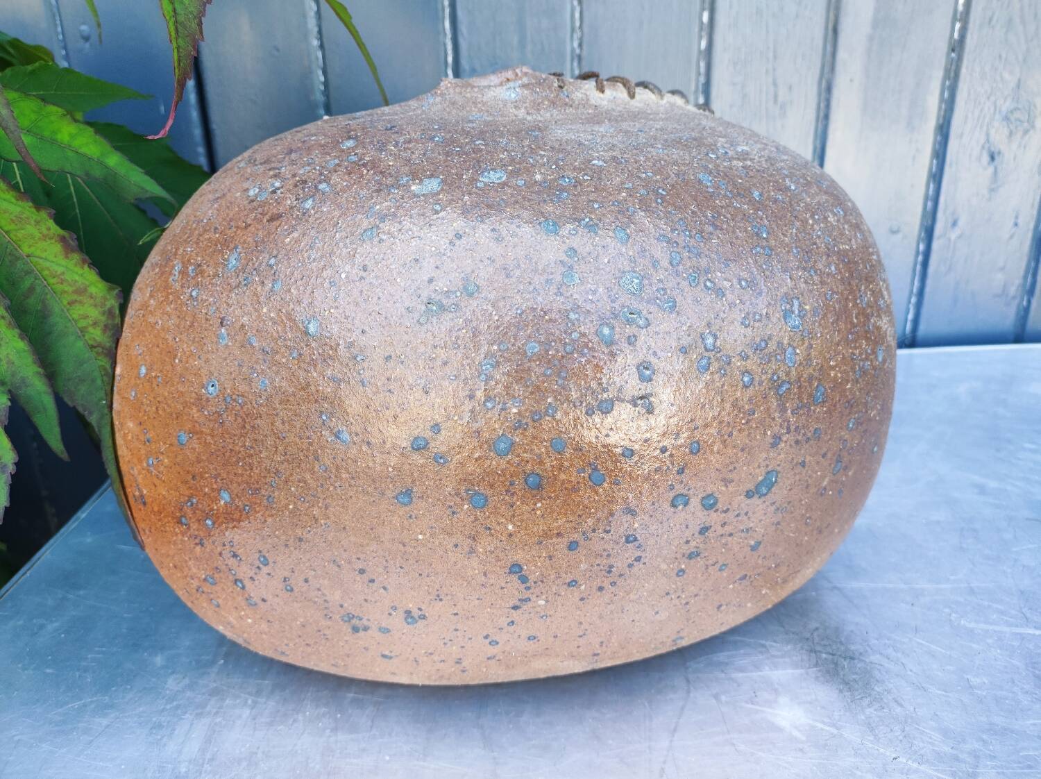 Vintage sandstone vase, in the shape of a rugby ball, signed