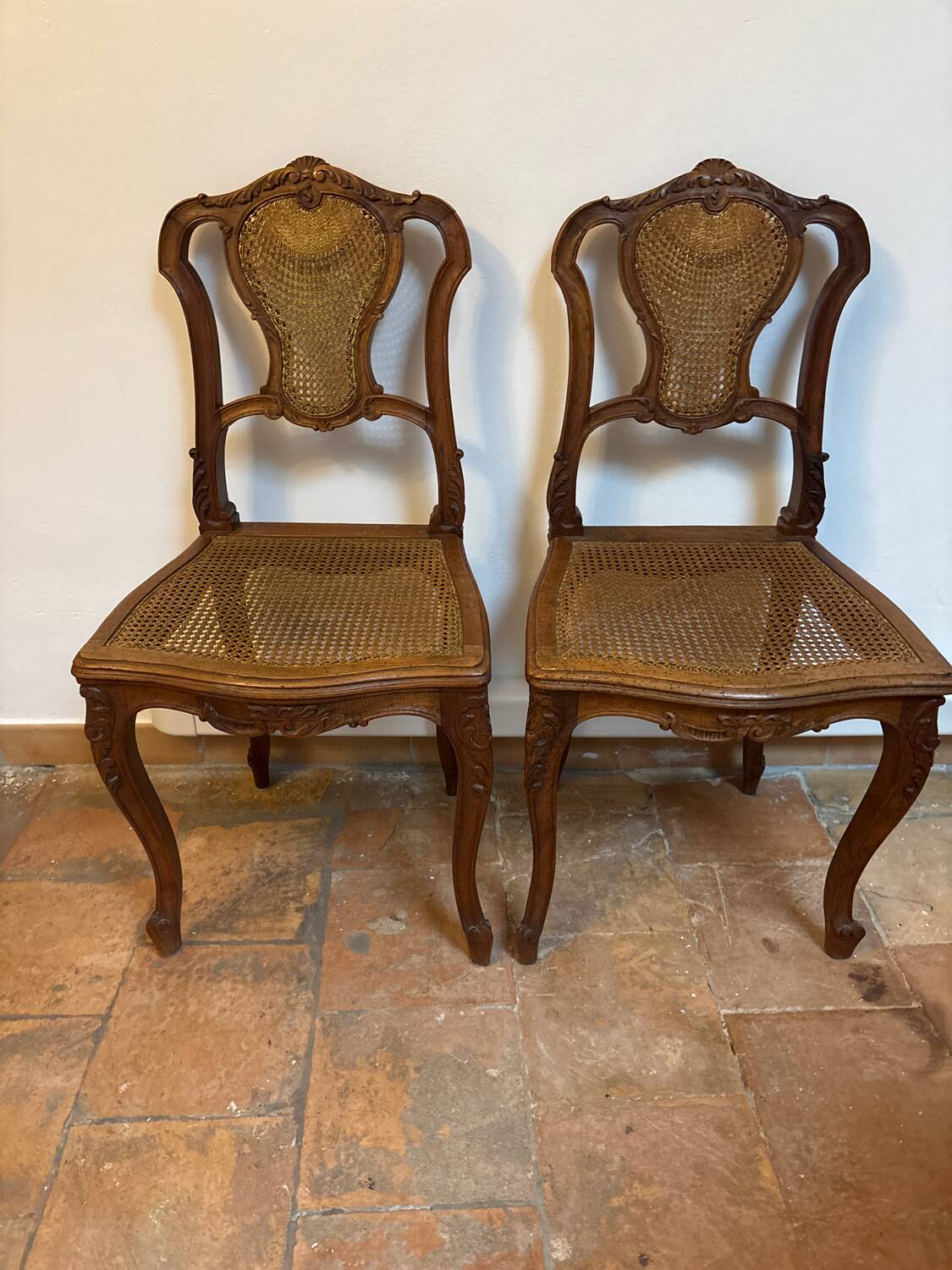 Pair of Louis XV style chairs in wood and caning.