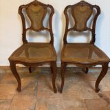 Pair of Louis XV style chairs in wood and caning.